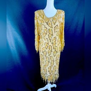 100% silk beaded gown with fringe detail. Authentic vintage from the 40s. SZ 12